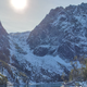 You can add an additional 10 miles round-trip by hiking up the snowy pass directly below the sun, hitting the summit, and coming down the pass to the right